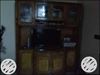 Brown Wooden TV Hutch With Flat Screen Television