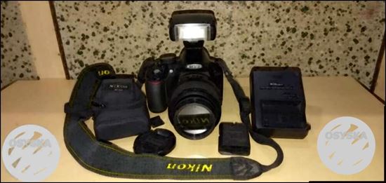 Black Canon DSLR Camera With Bag