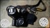 Black Nikon DSLR Camera With Bag