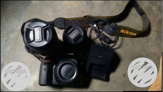 Black Nikon DSLR Camera With Bag
