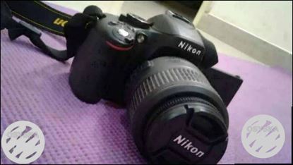 Black Nikon DSLR Camera With Lens