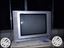 Gray CRT TV With Brown Wooden TV Hutch
