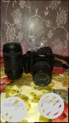 Black Canon DSLR Camera With Lens