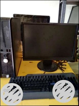 Black Flat Screen Computer Monitor And Keyboard