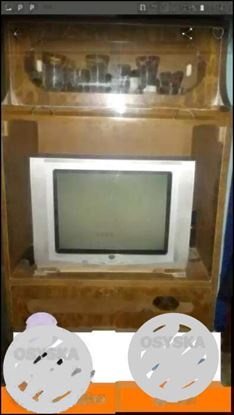 Gray CRT Television With Brown Wooden TV Hutch