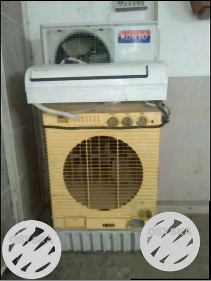 White Split-type Air Conditioner And Beige Portable Air Conditioner