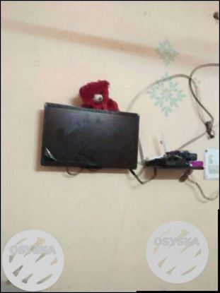 Black Flat Screen TV With Remote