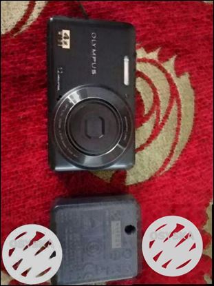 Olympus Canara with cover and 4gb memory card
