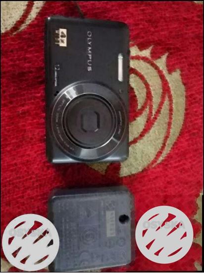 Olympus Canara with cover and 4gb memory card