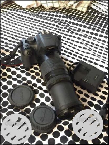 Black Canon DSLR Camera With Lens