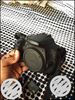 Black Canon DSLR Camera With Lens