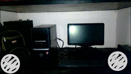 Black Flat Screen Computer Monitor And Black Computer Keyboard